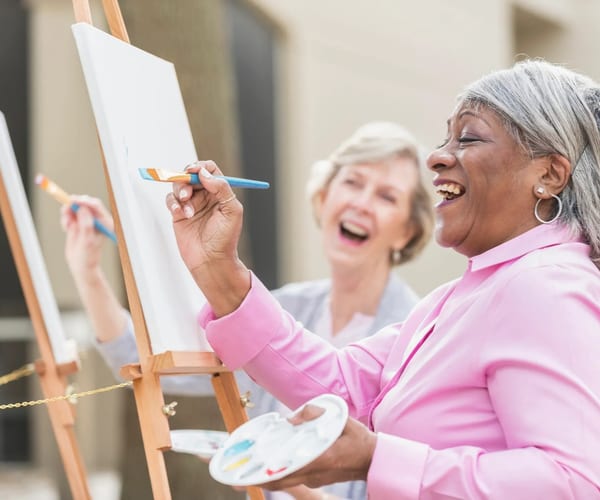 Senior women enjoying an art painting class
